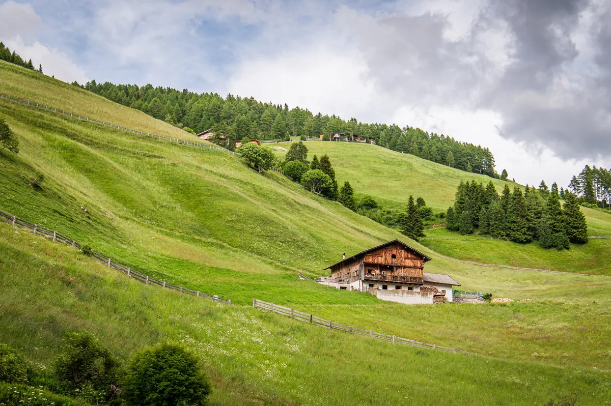 Cabin against green hills